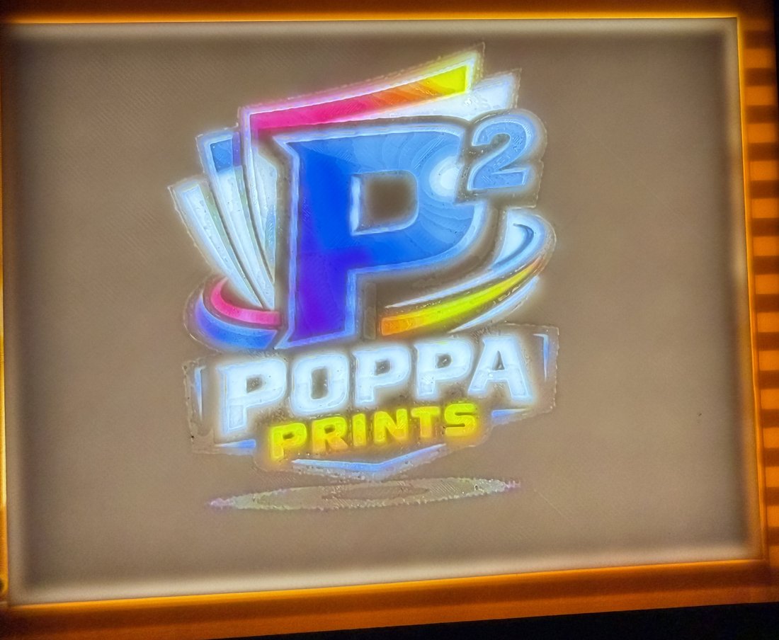 The Poppa Prints logo printed as a glowing backlit lithophane